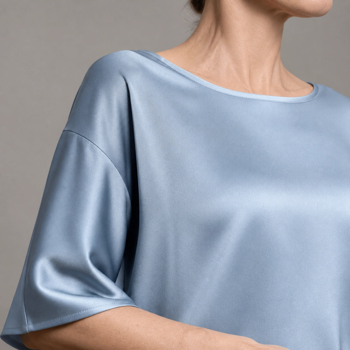 Powder blue satin blouse neckline and sleeve construction detail — view 9