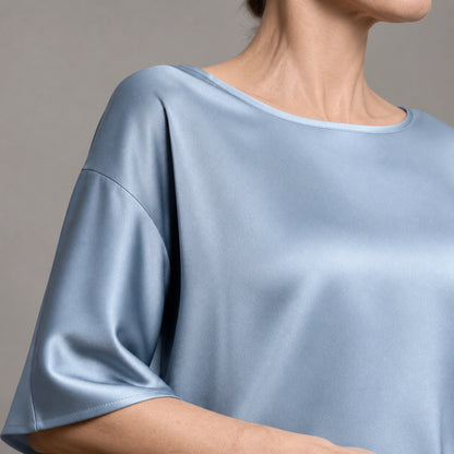 Powder blue satin blouse neckline and sleeve construction detail — view 9
