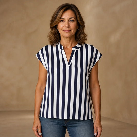 Navy and white stripe loose satin blouse front view on a mature woman