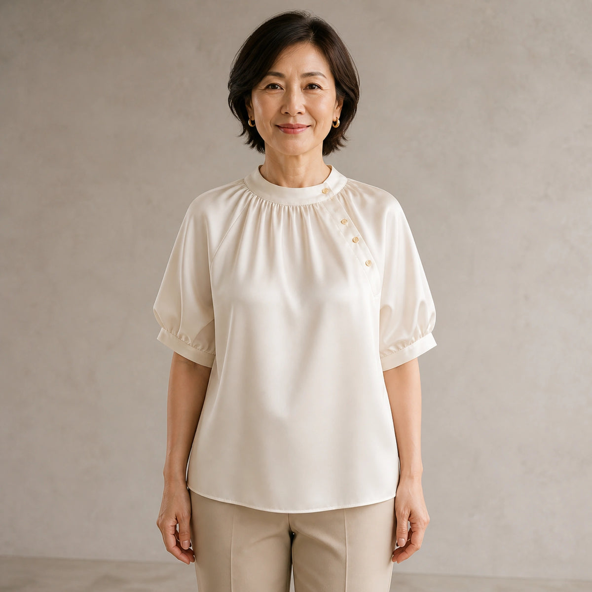 Champagne gathered satin blouse complete front view on a mature woman