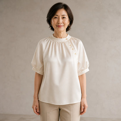 Champagne gathered satin blouse complete front view on a mature woman