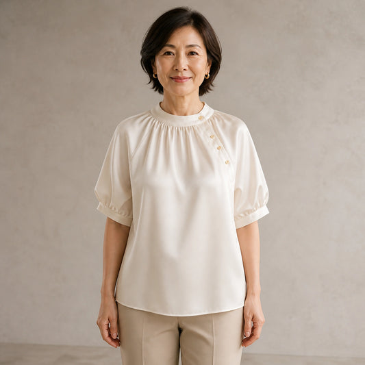 Champagne gathered satin blouse complete front view on a mature woman