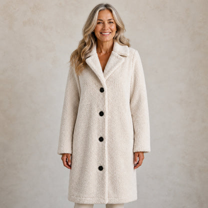 winter coat — Mature woman wearing ivory long teddy fleece button coat front view