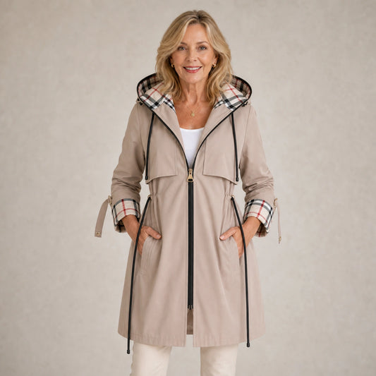 winter coat — Mature woman wearing light beige plaid lined adjustable hooded long coat front view — view 2